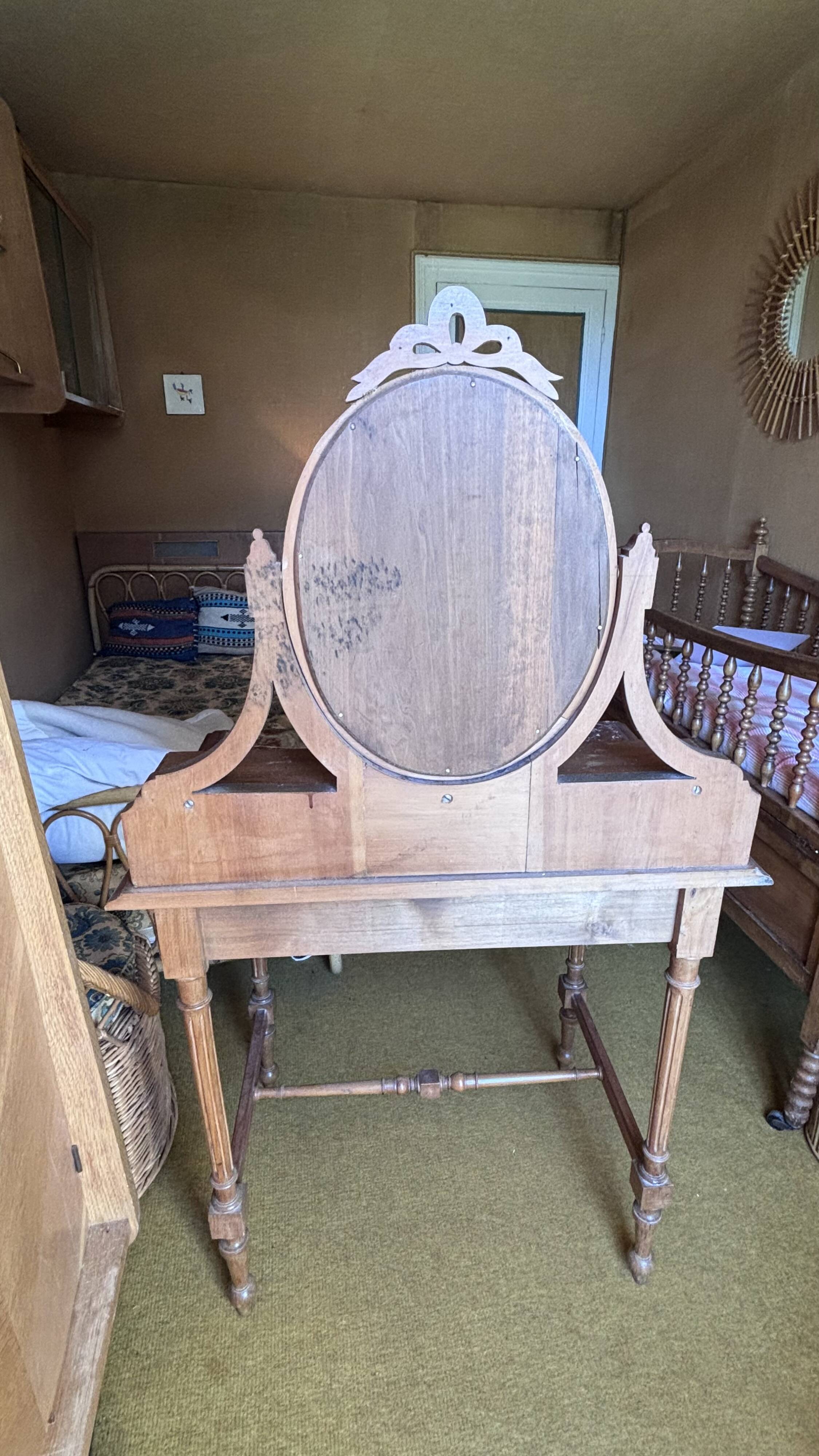 Antique oak and red marble dressing table with a swivel mirror.