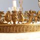Antique chandelier in gilded bronze with neoclassical decorations from the 19th century.