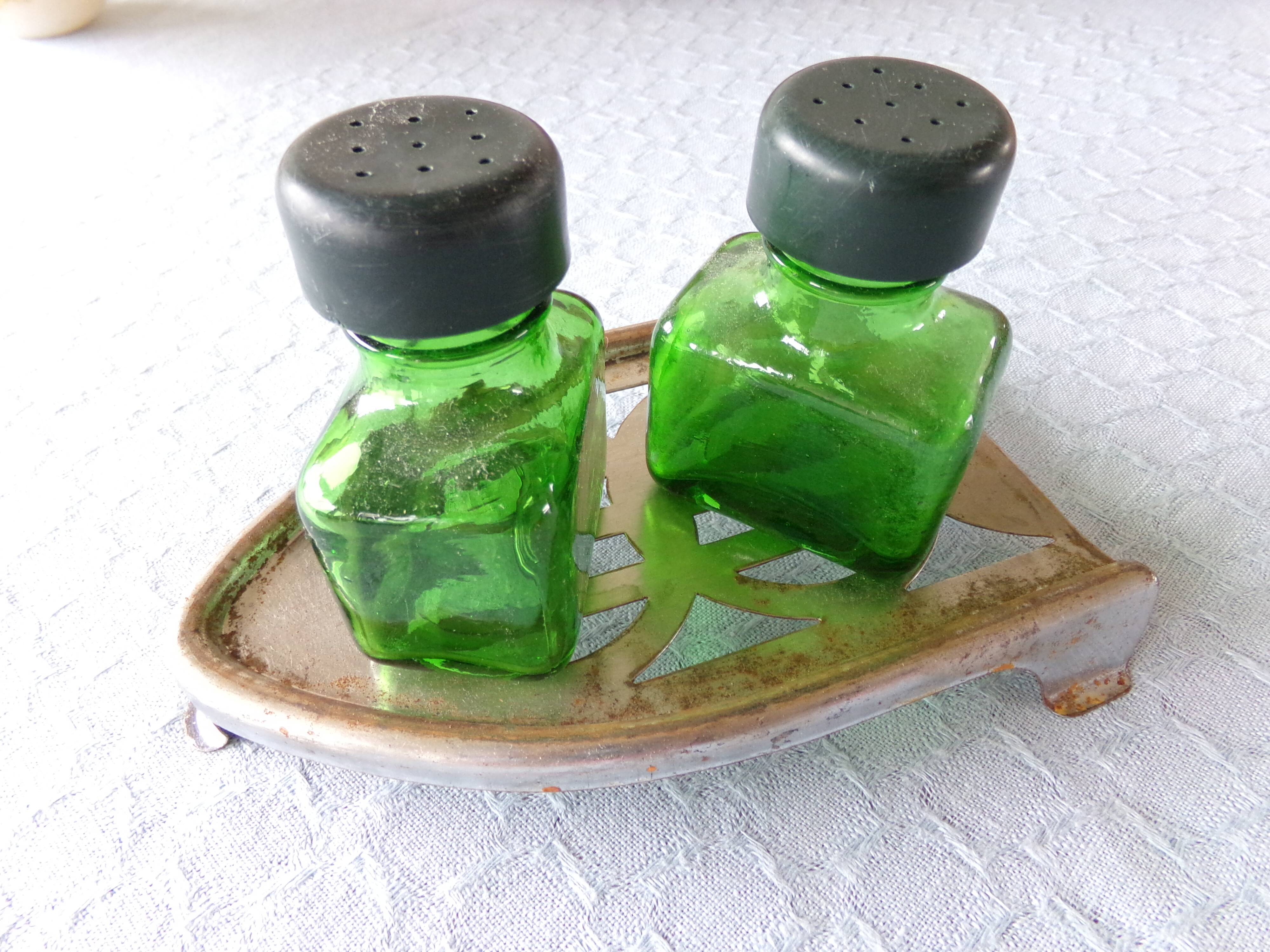 Salt/pepper green glass jars on metal base