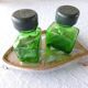 Salt/pepper green glass jars on metal base