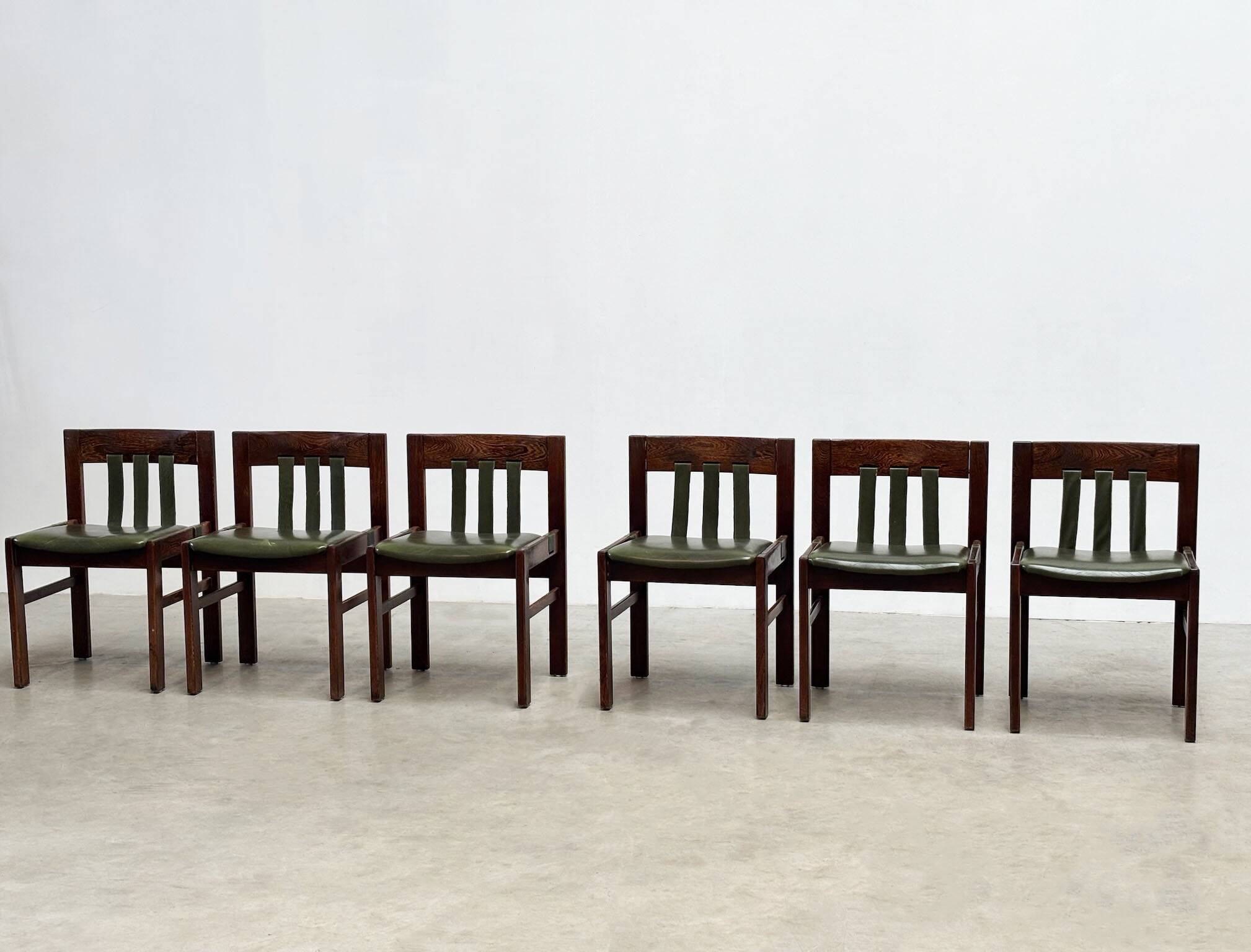 Green leather brutalist dining chairs