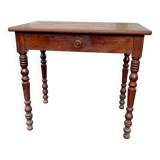 Wooden side table with turned legs
