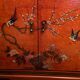 Low sideboard with lacquered decoration with birds on orange background Far East China Japan