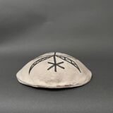 Africanist mask in glazed white terracotta, face signed Colette.