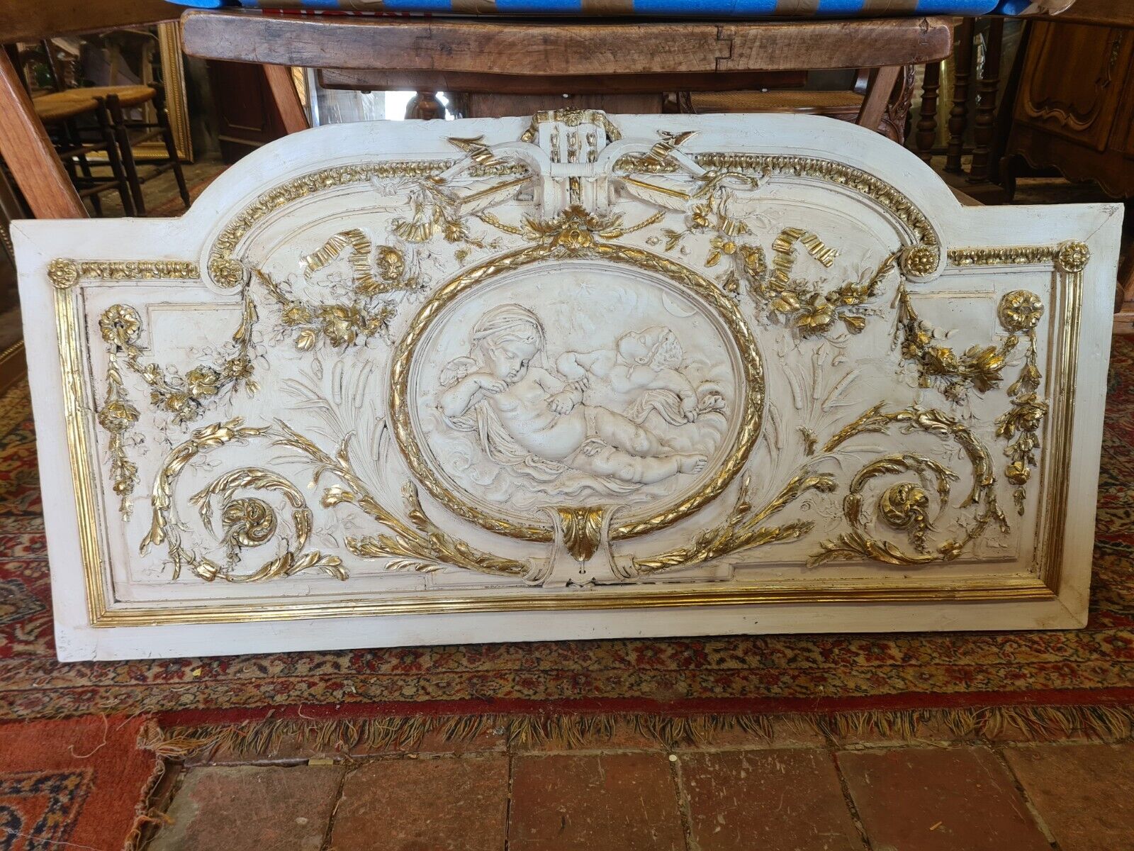 Pediment panel with stucco and wood angels