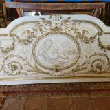 Pediment panel with stucco and wood angels