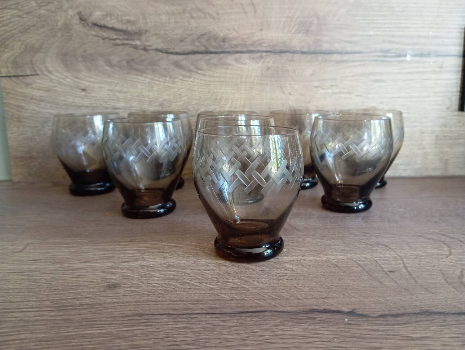 Set of 9 digestive glasses, smoked glass cut in art deco style