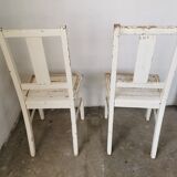 Set of 6 mismatched white chairs