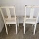 Set of 6 mismatched white chairs