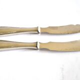 Two antique service knives in silver-plated metal, pearl frieze gowe alpacca.
