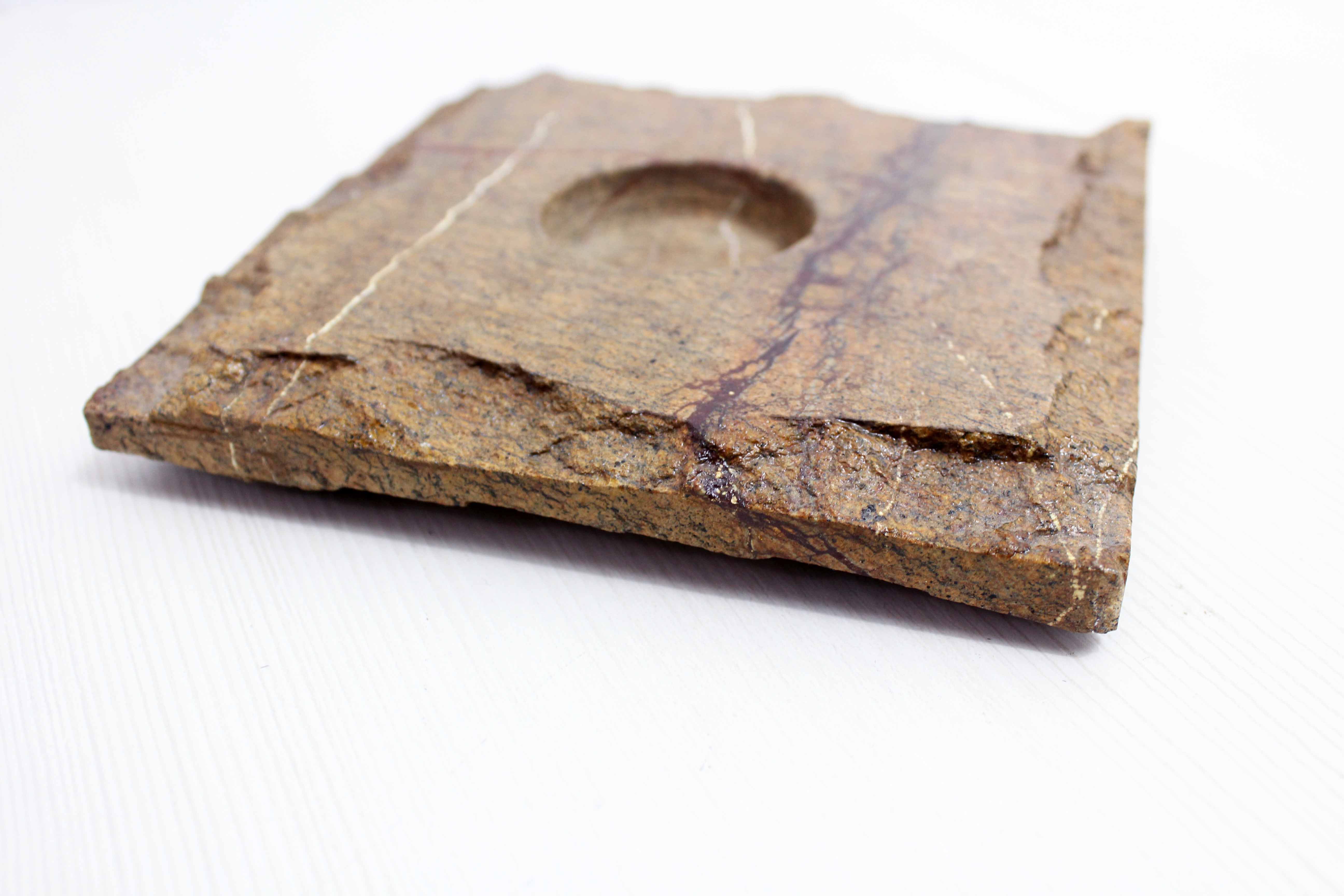 Pair of brutalist travertine candle holders
