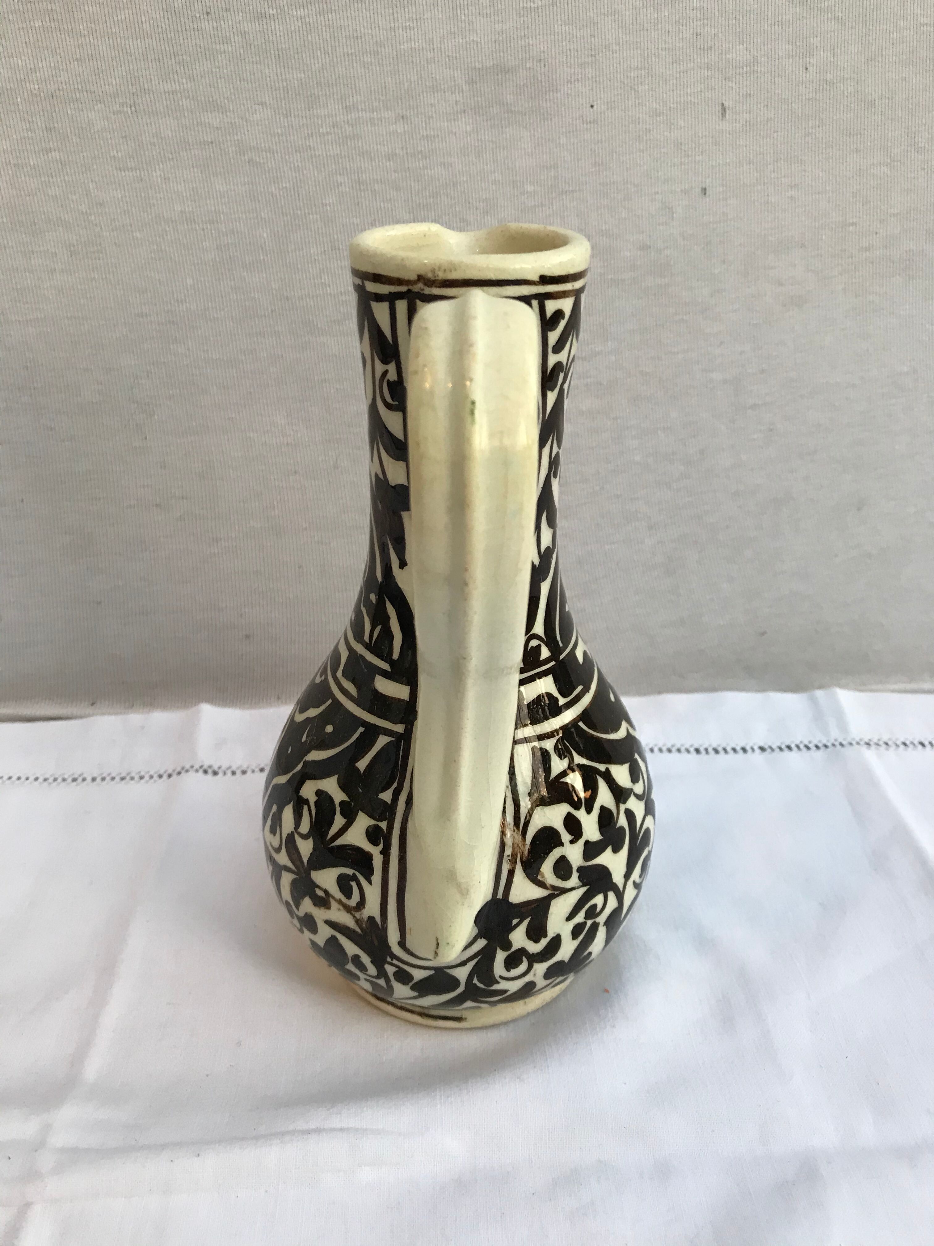 Former beige cracked ceramic pitcher