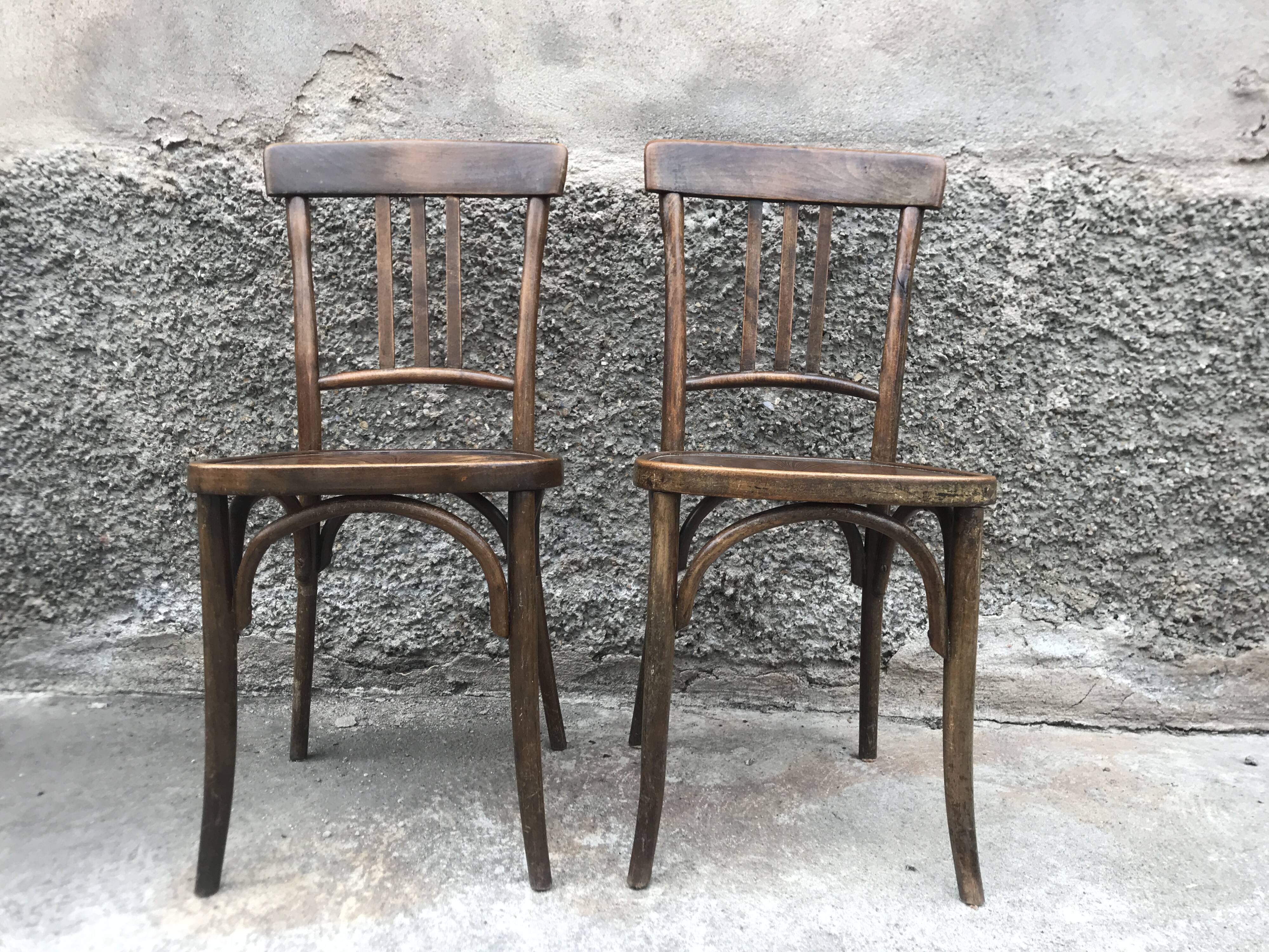 Pair of brasserie bistro chairs with seashell on seat