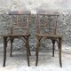 Pair of brasserie bistro chairs with seashell on seat