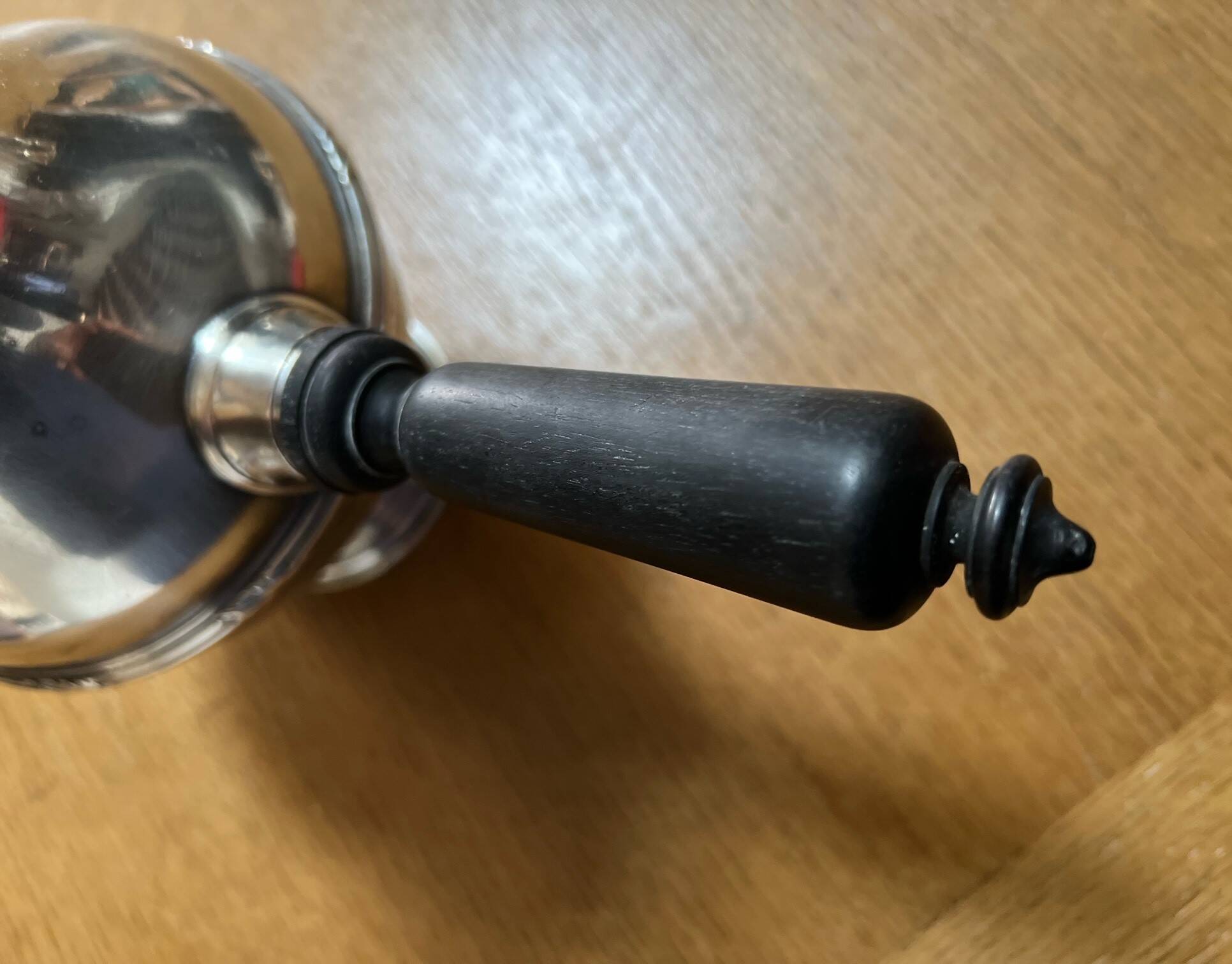 Silver-plated metal chocolate pot stamped ARGIT SFOA with an ebony handle.