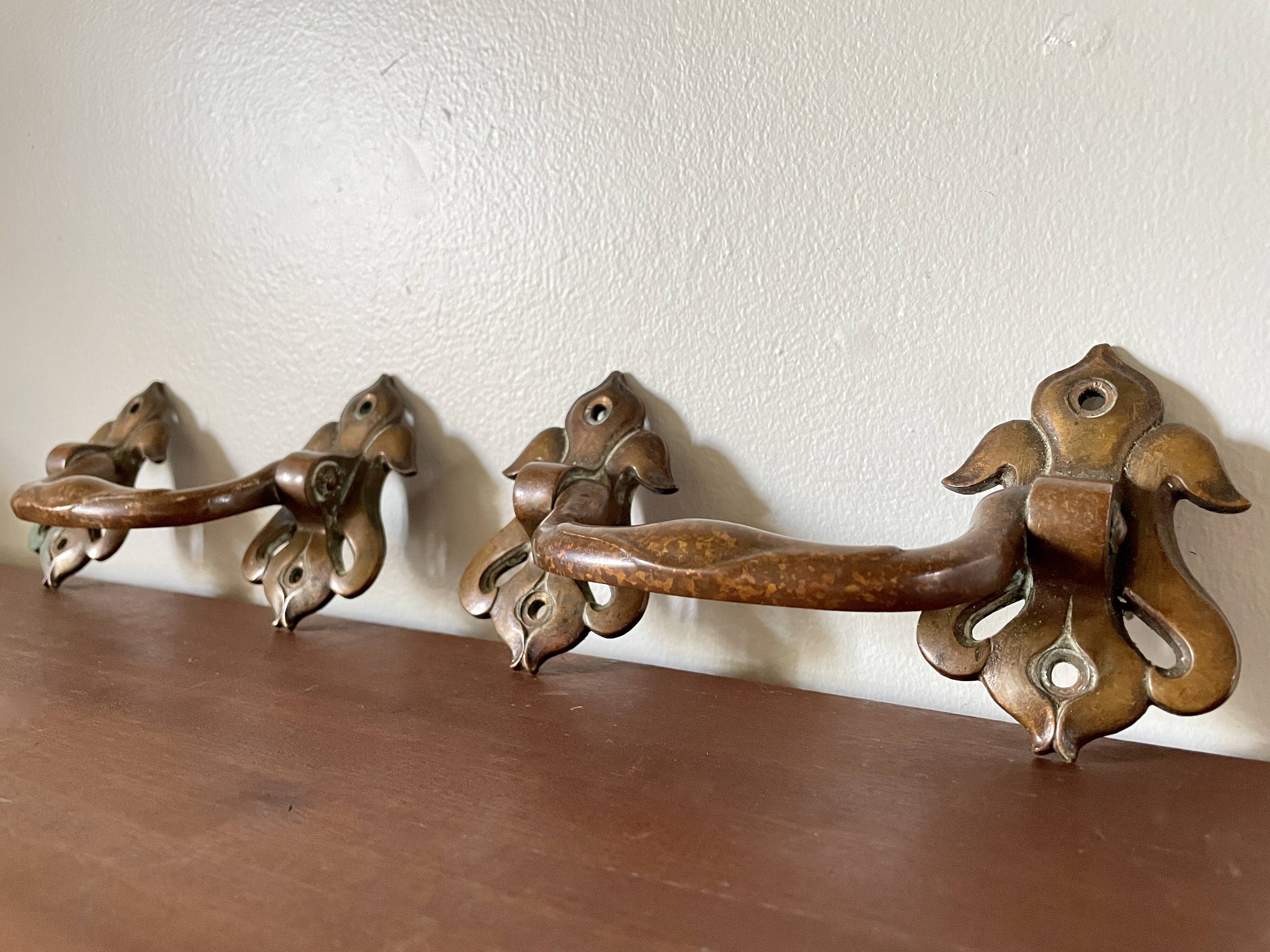 Pair of bronze handles by Emile Muller, 19th century.