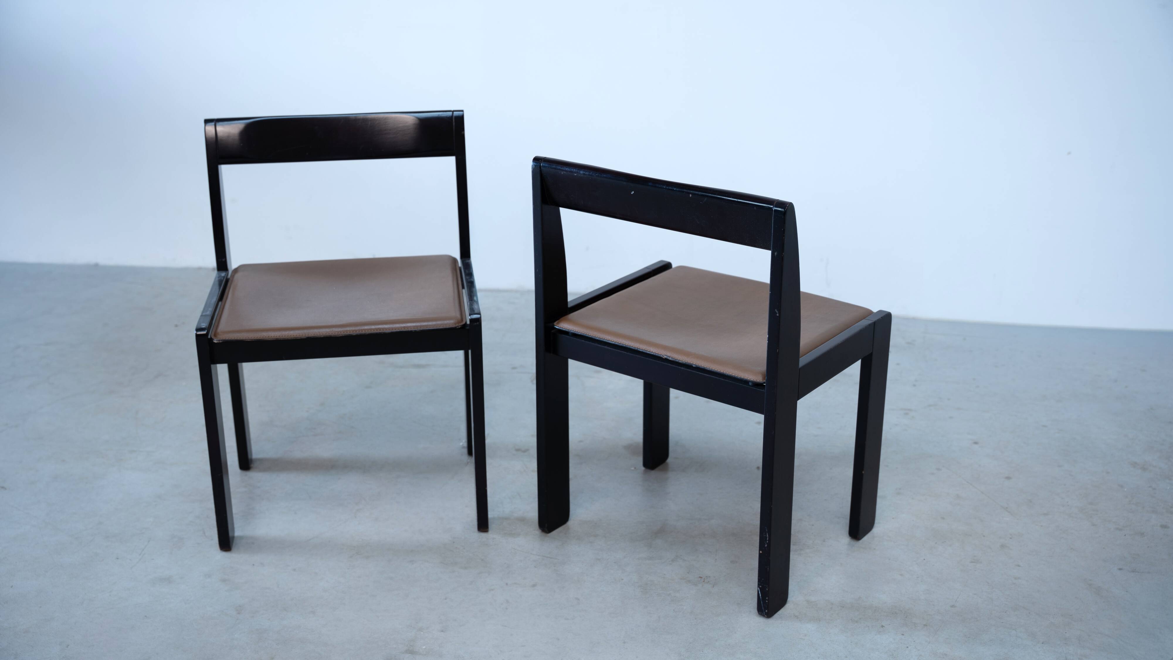 Set of eight black lacquered dining chairs