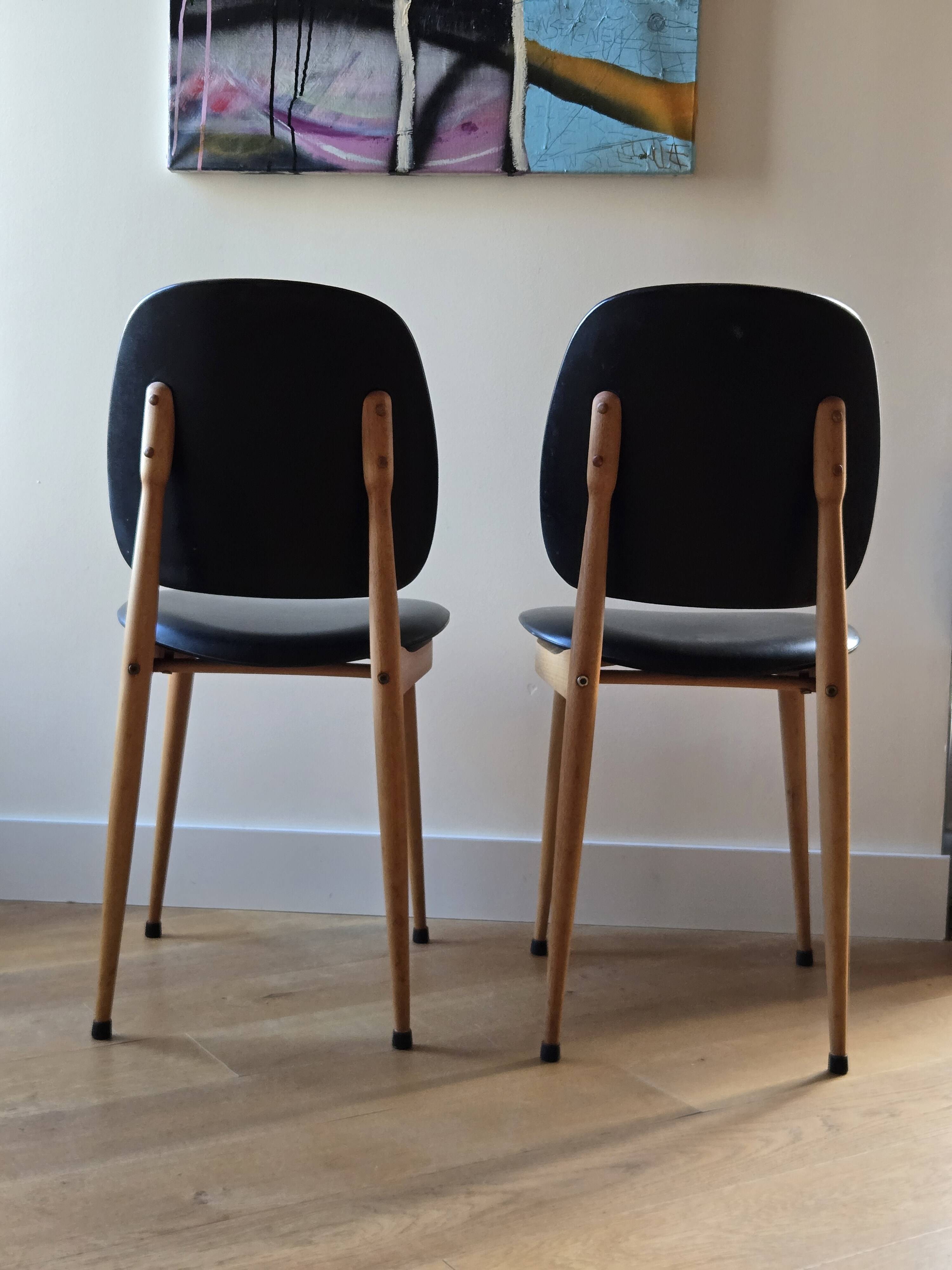 Pair of Baumann Pegasus chairs in wood and leather - design by Pierre Guariche