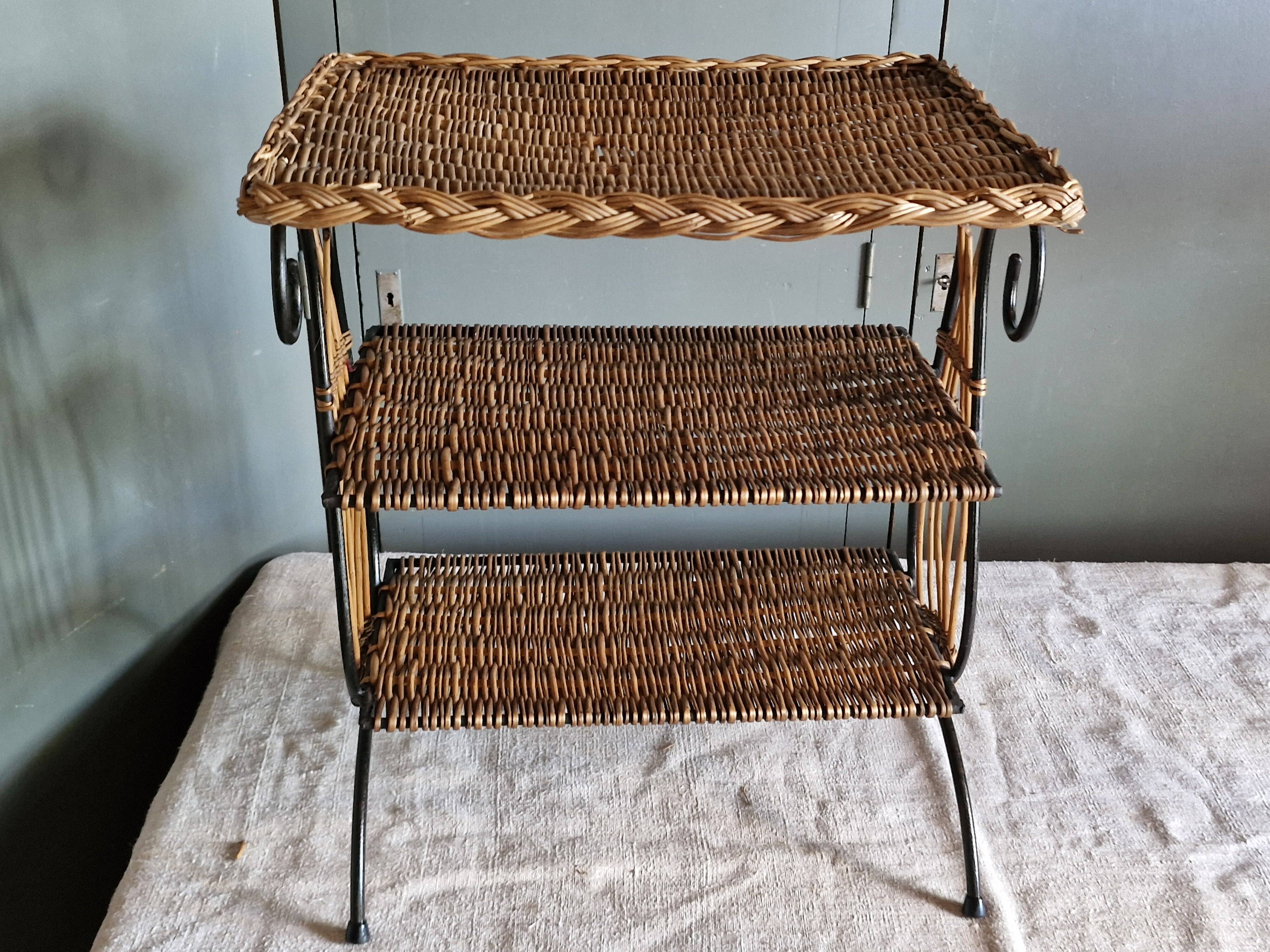 Small antique piece of furniture from the 1960s made of rattan and wrought iron in the shape of a lyre.