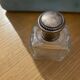 Old perfume bottle silver metal cap