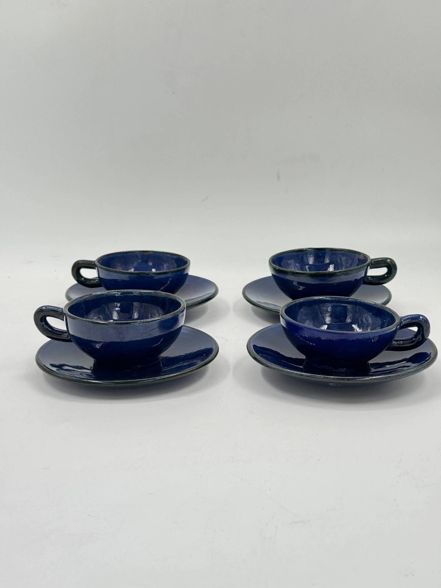 Set of 4 vintage ceramic cups and saucers, cobalt blue glaze.