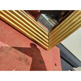 Wooden mirror and gold trim