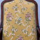 Louis XV style cabriolet armchair in solid wood, yellow floral fabric.