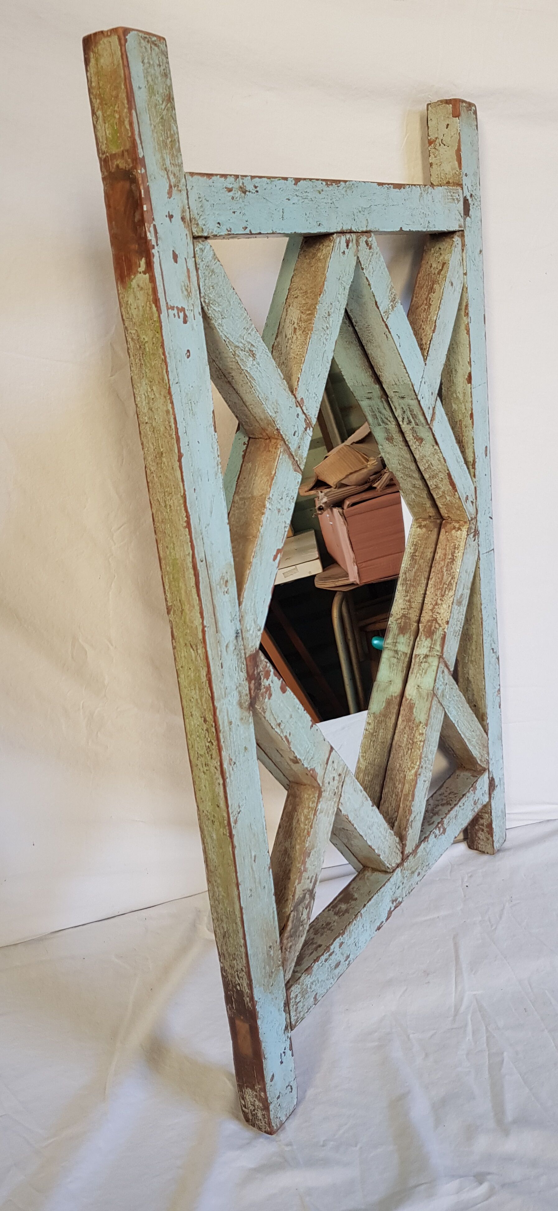 Old mirror claustras in Burmese teak