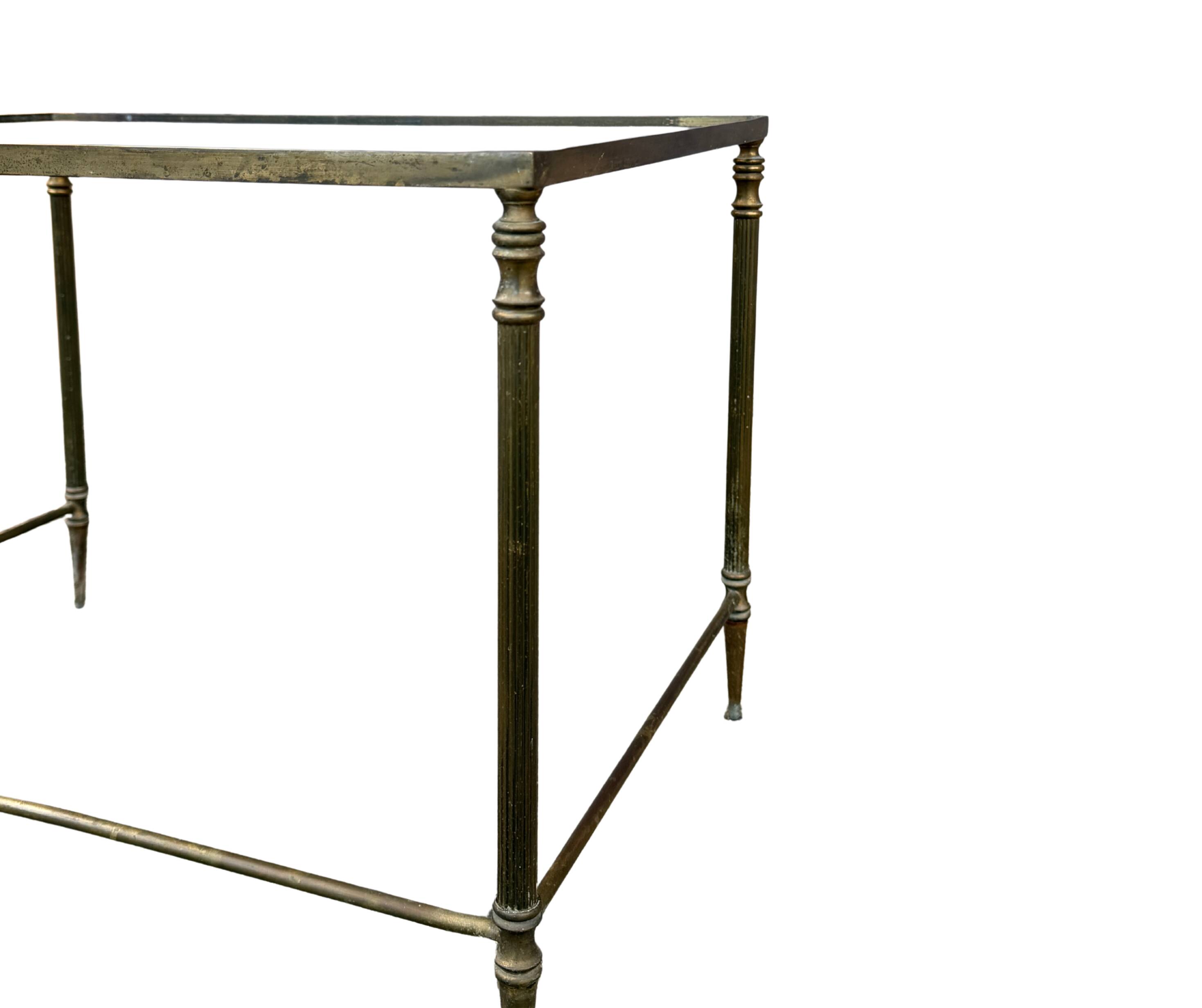 Side table in brass and smoked glass