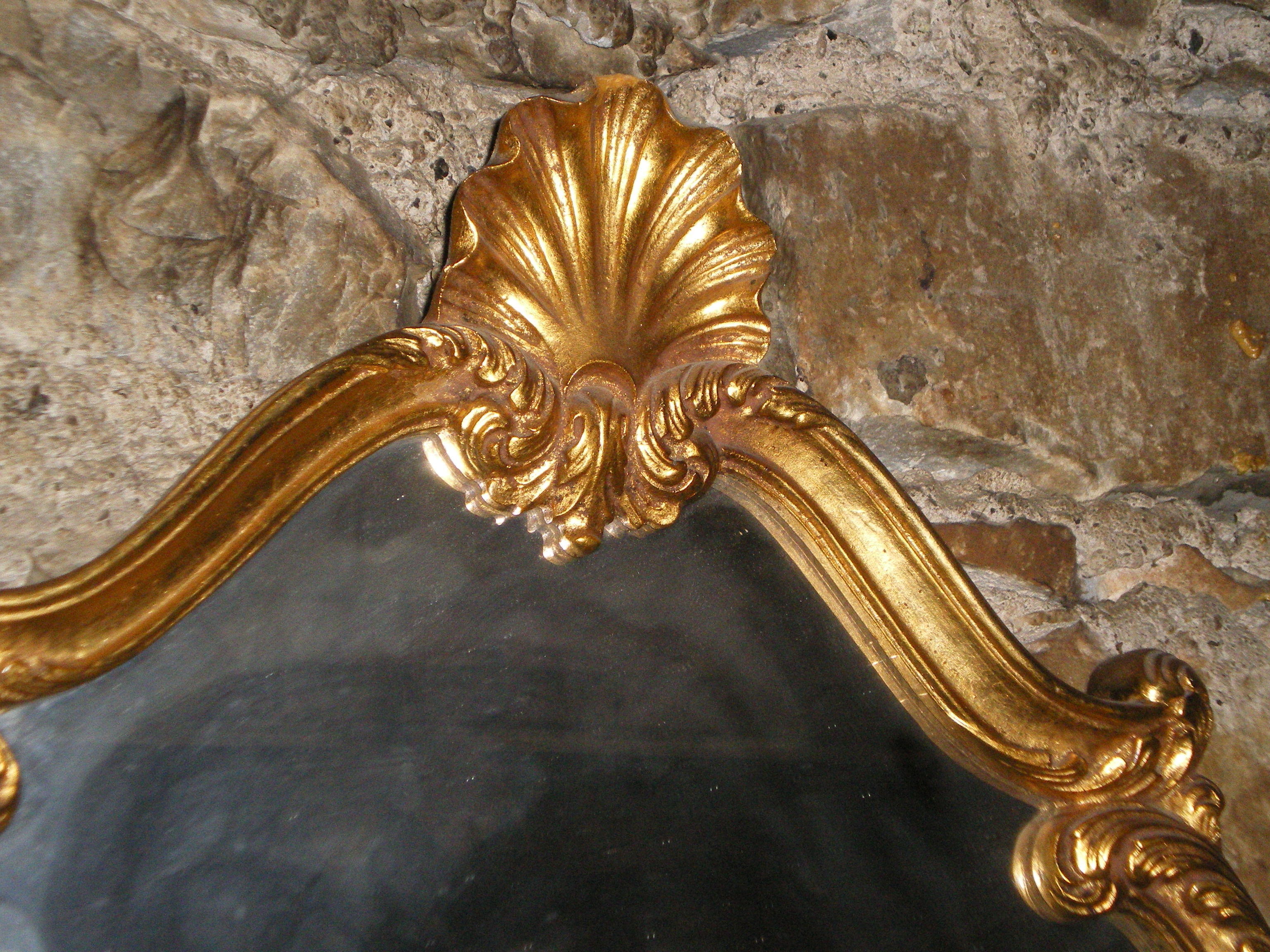 Large gilded mirror Louis XV style with shell.