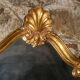 Large gilded mirror Louis XV style with shell.