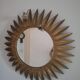 Large sun mirror in gilded metal. 1960