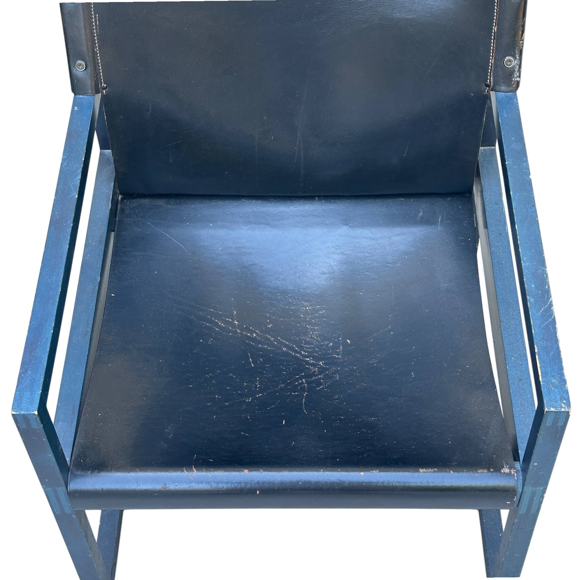 Postmodern lounge chair in black saddle leather and midnight blue wood, 1980.