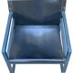 Postmodern lounge chair in black saddle leather and midnight blue wood, 1980.