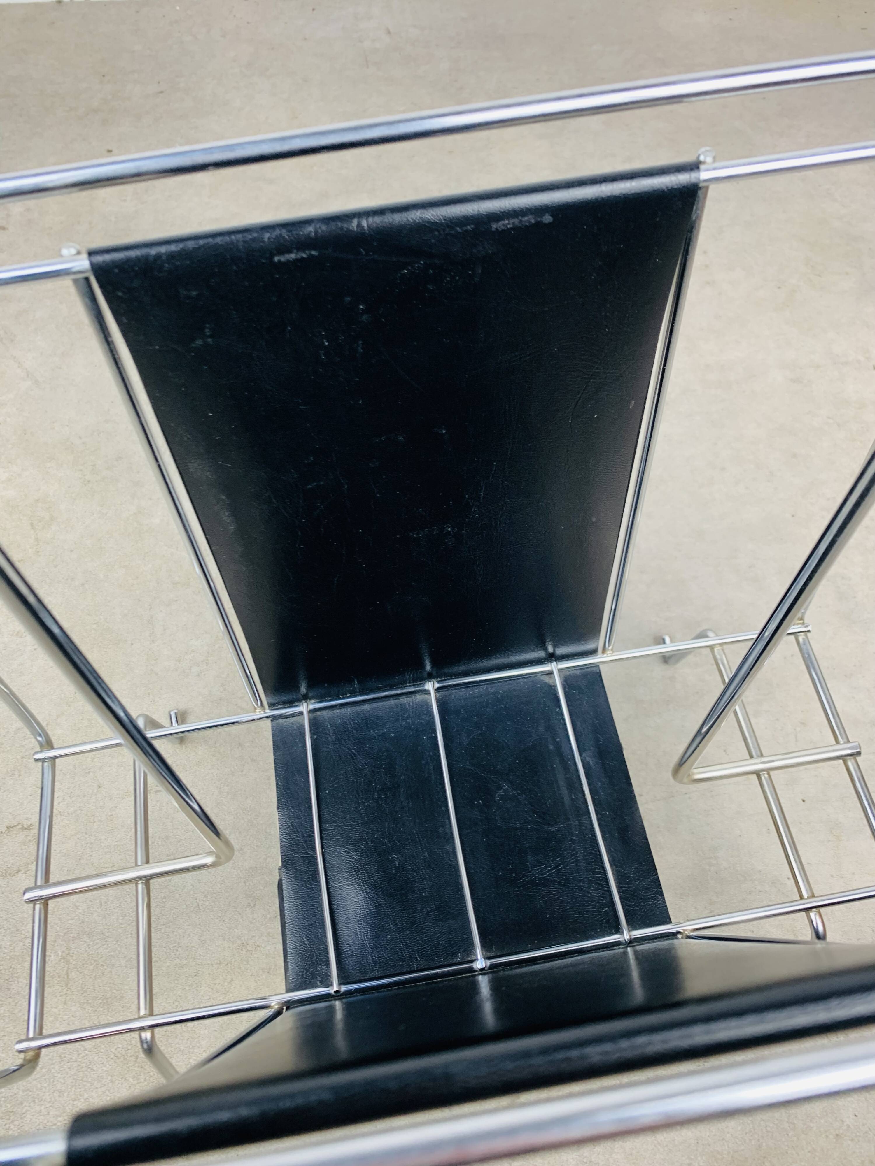Chrome and black leather magazine rack, 1970s.