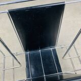 Chrome and black leather magazine rack, 1970s.