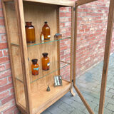 Restored antique oak display cabinet with glass shelves.