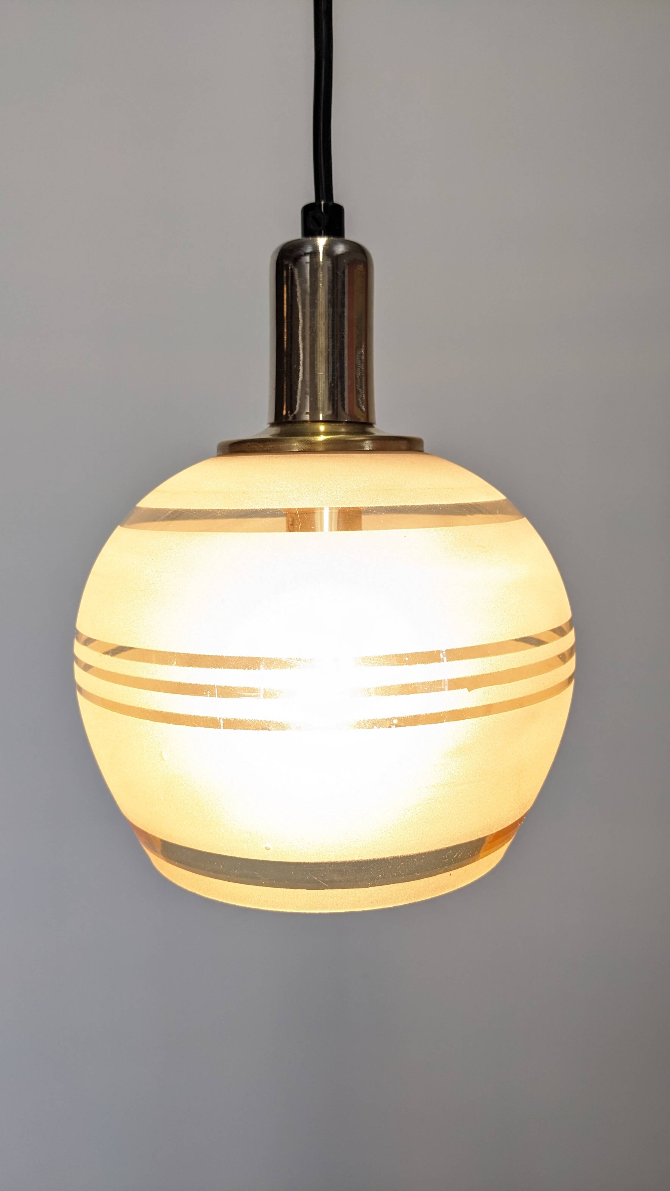 Art Deco style ball pendant light in gold glass