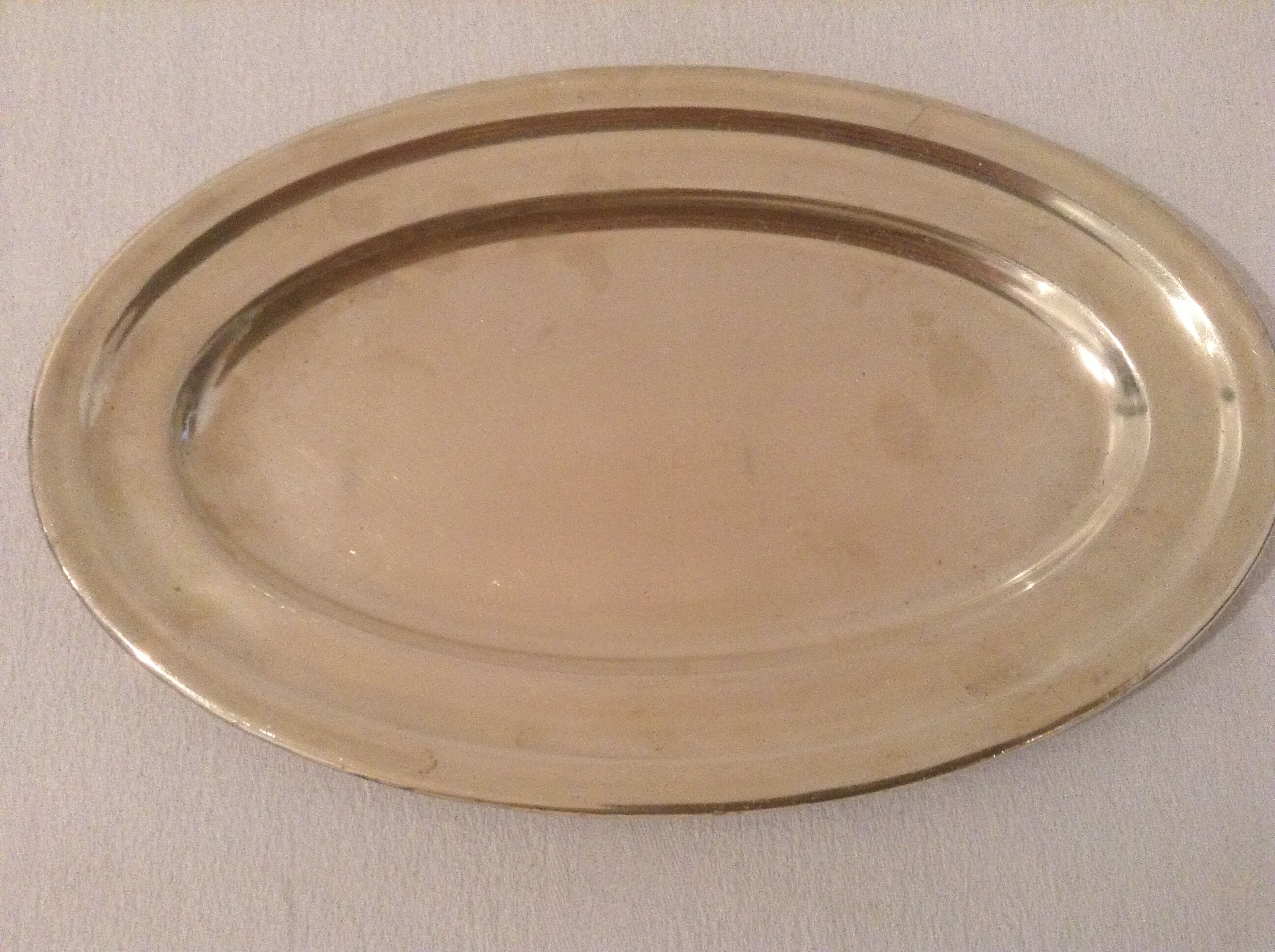 Flat oval silver metal