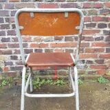 Chaise vintage datée 1955 assise en cuir