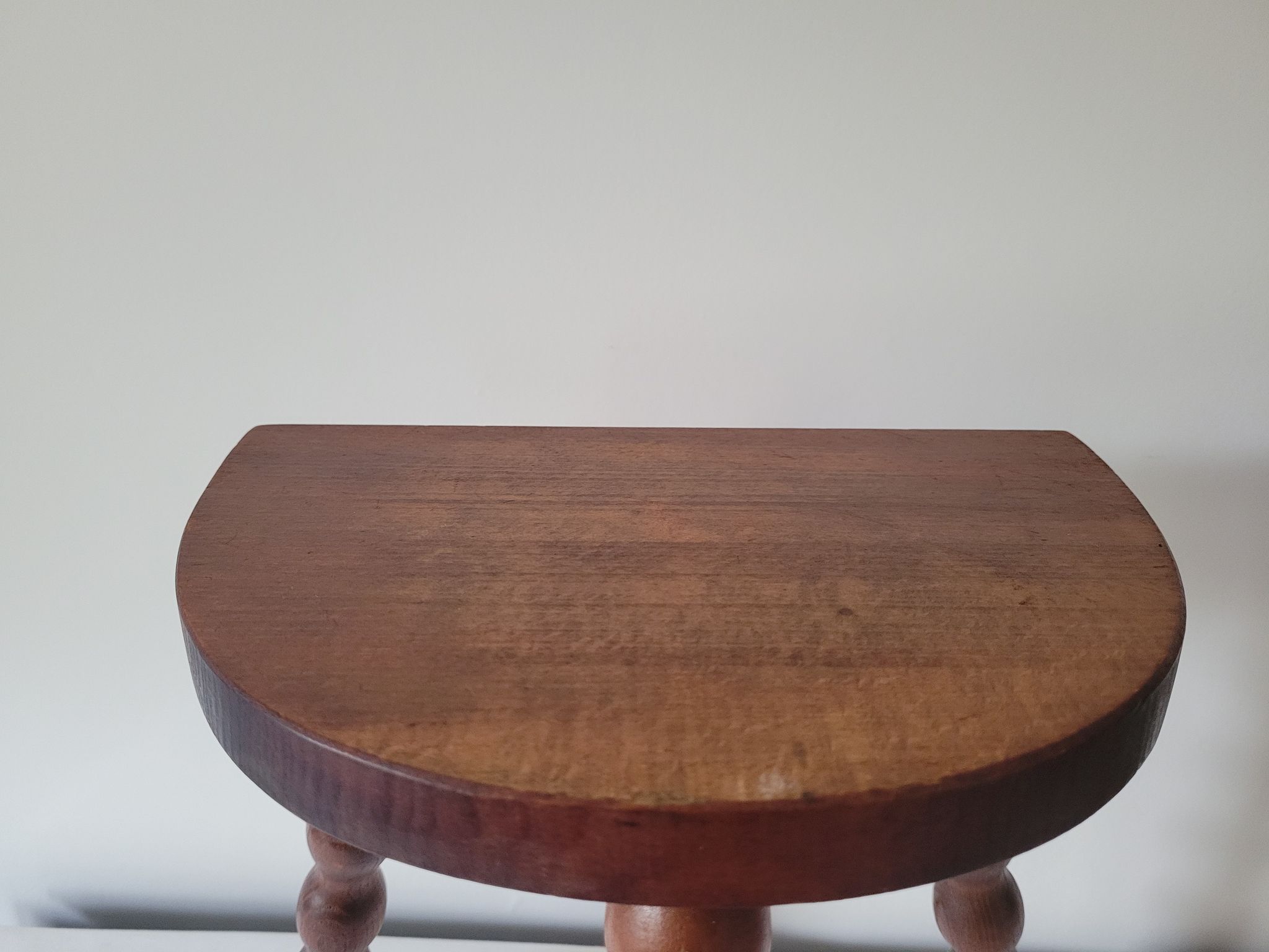 Brutalist stool turned wooden feet