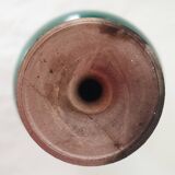 Green pot-bellied ceramic vase with foot and high, narrow neck in signed raku