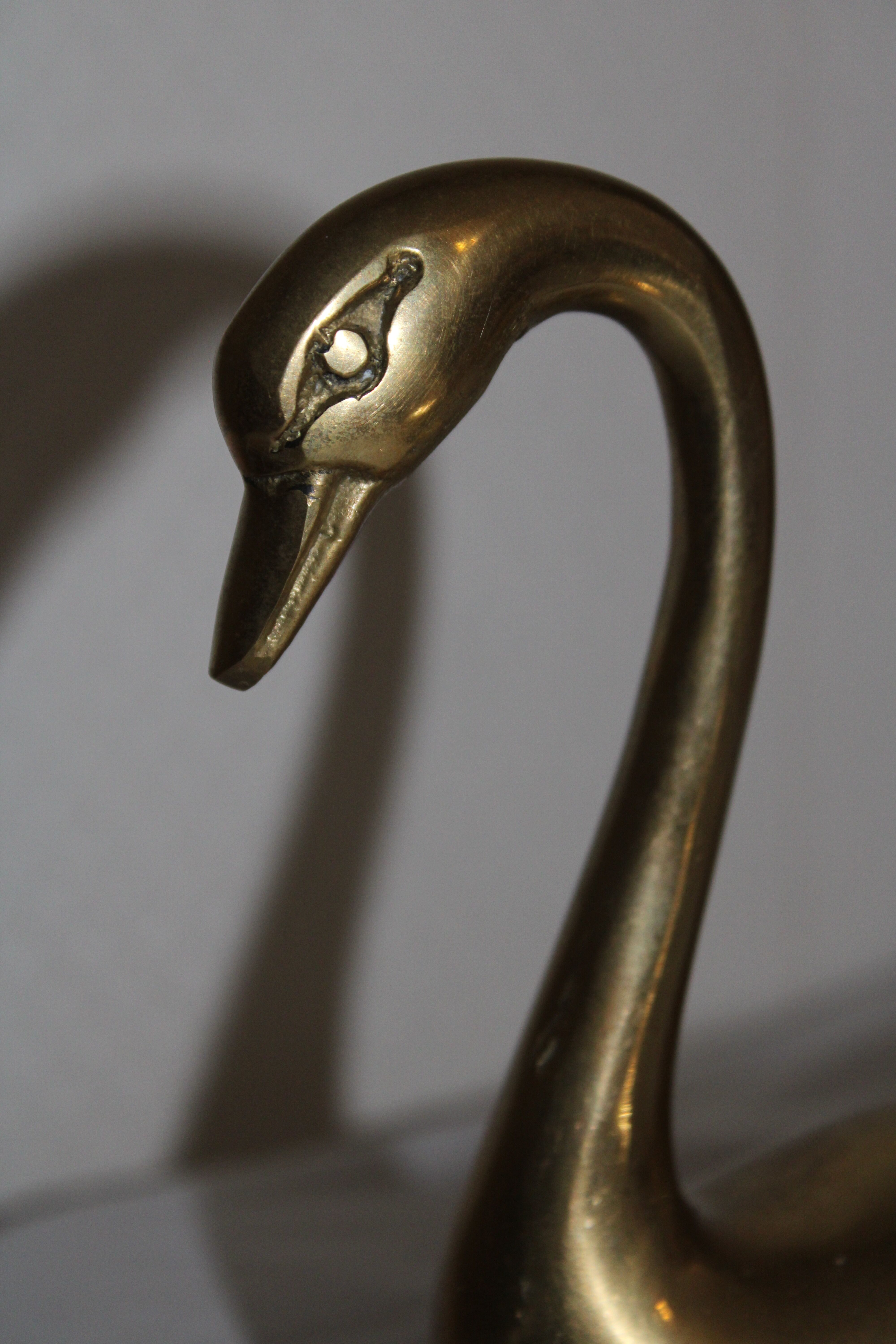 Couple of swans in vintage brass