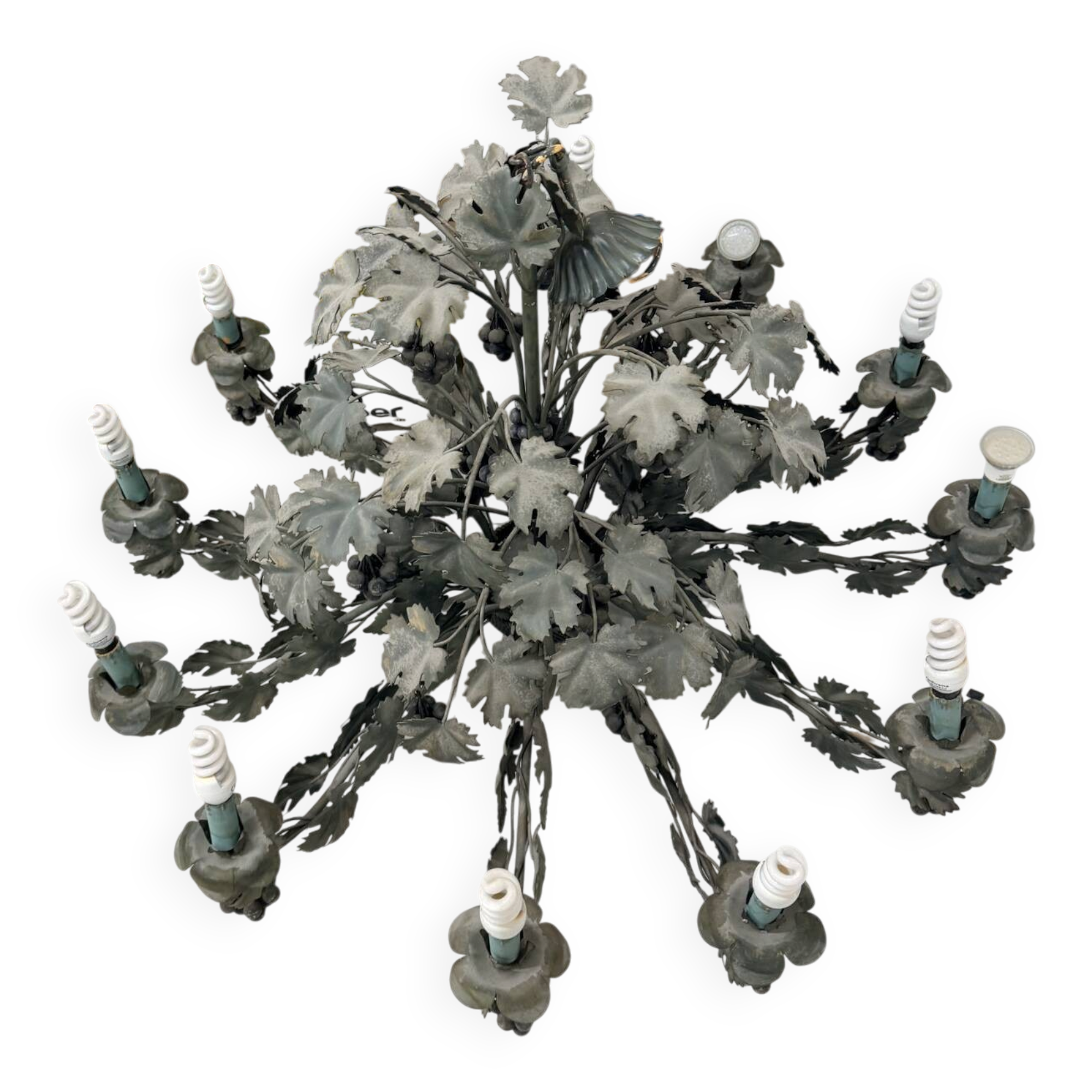 Old-fashioned country-style chandelier with virgin vine and bunch of grapes.
