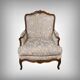 Queen's bergère in carved beech, Louis XV period – mid 18th century