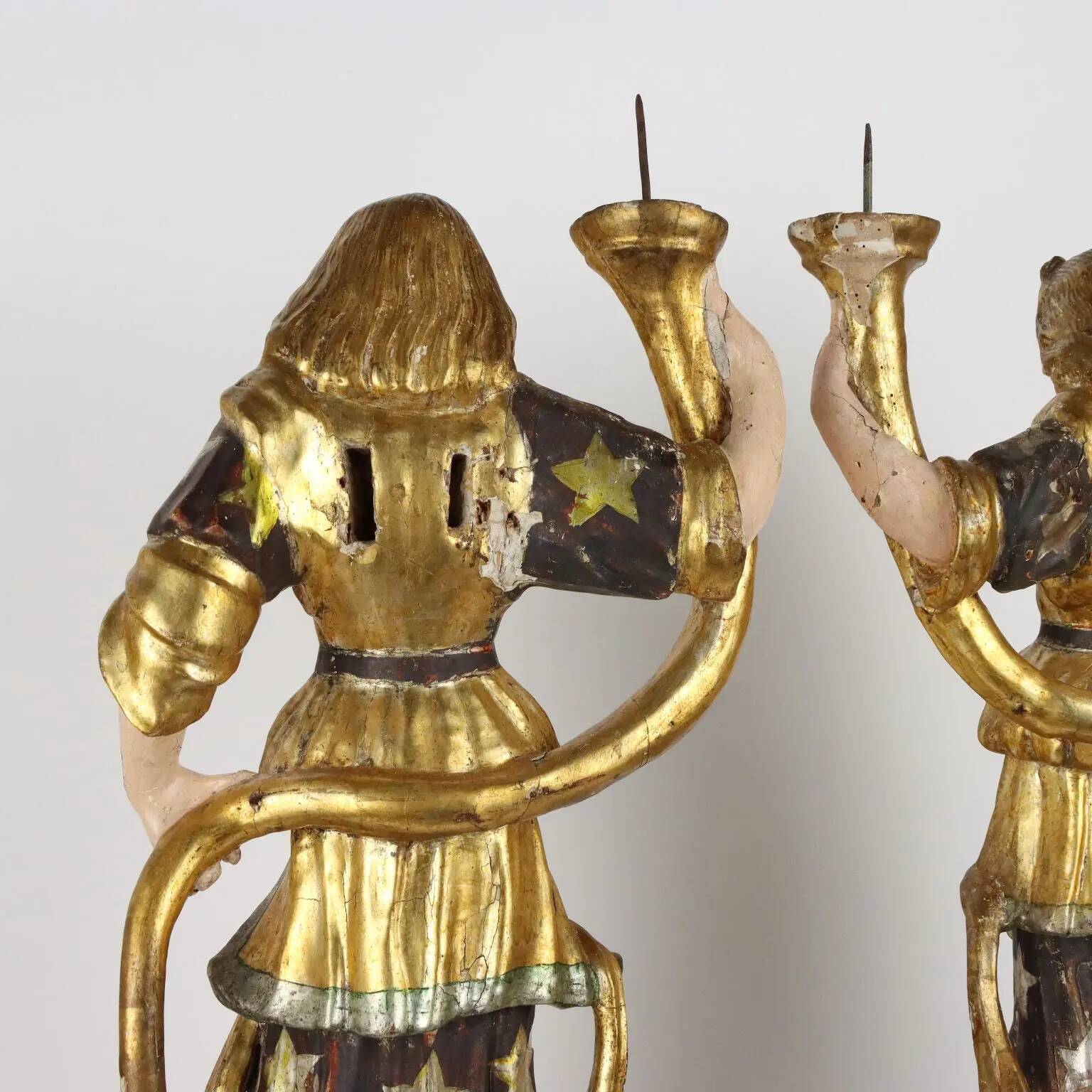 Antique wooden lacquered angel-shaped candlesticks, 18th century.