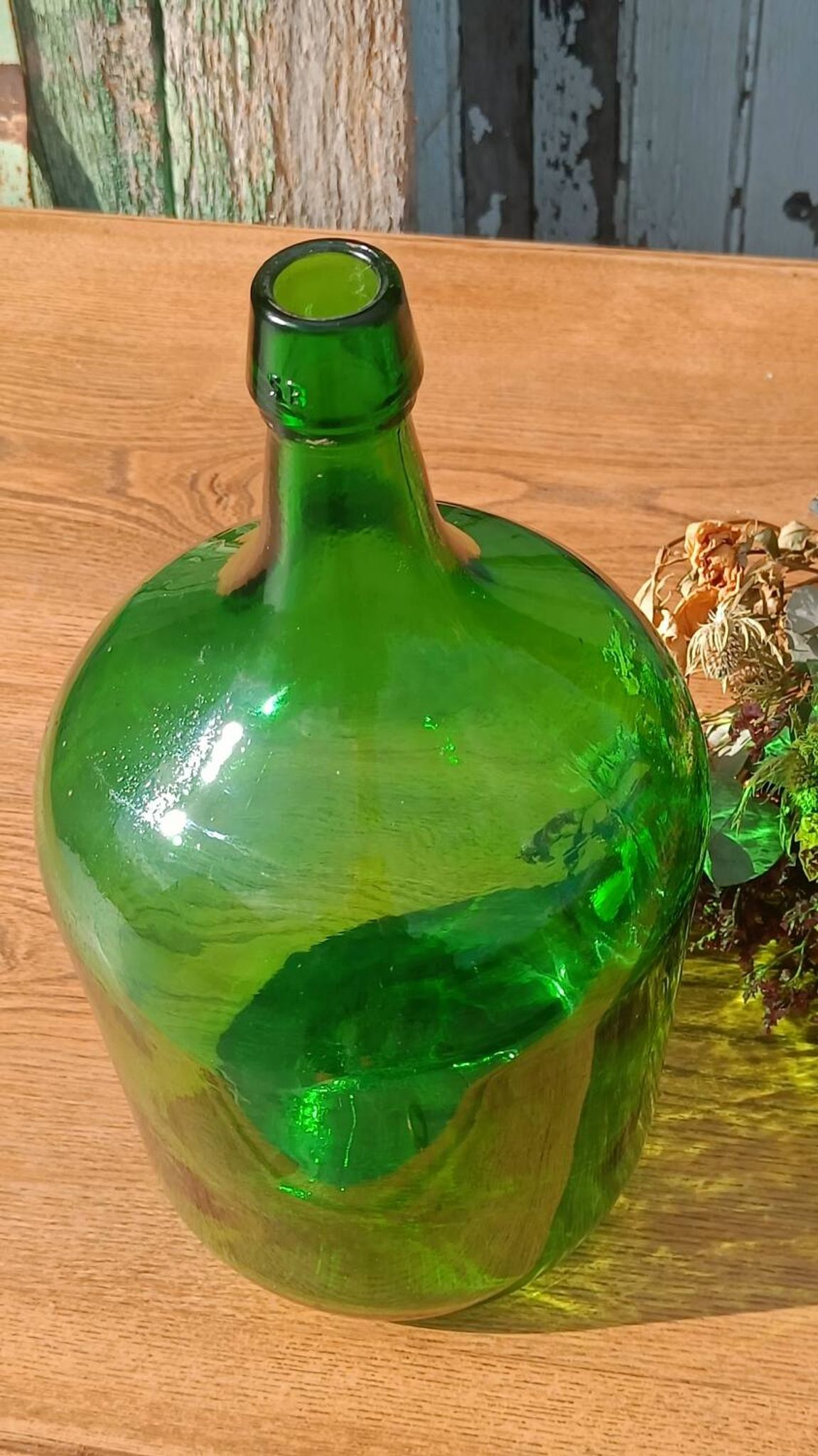 Superb antique green glass demijohn.