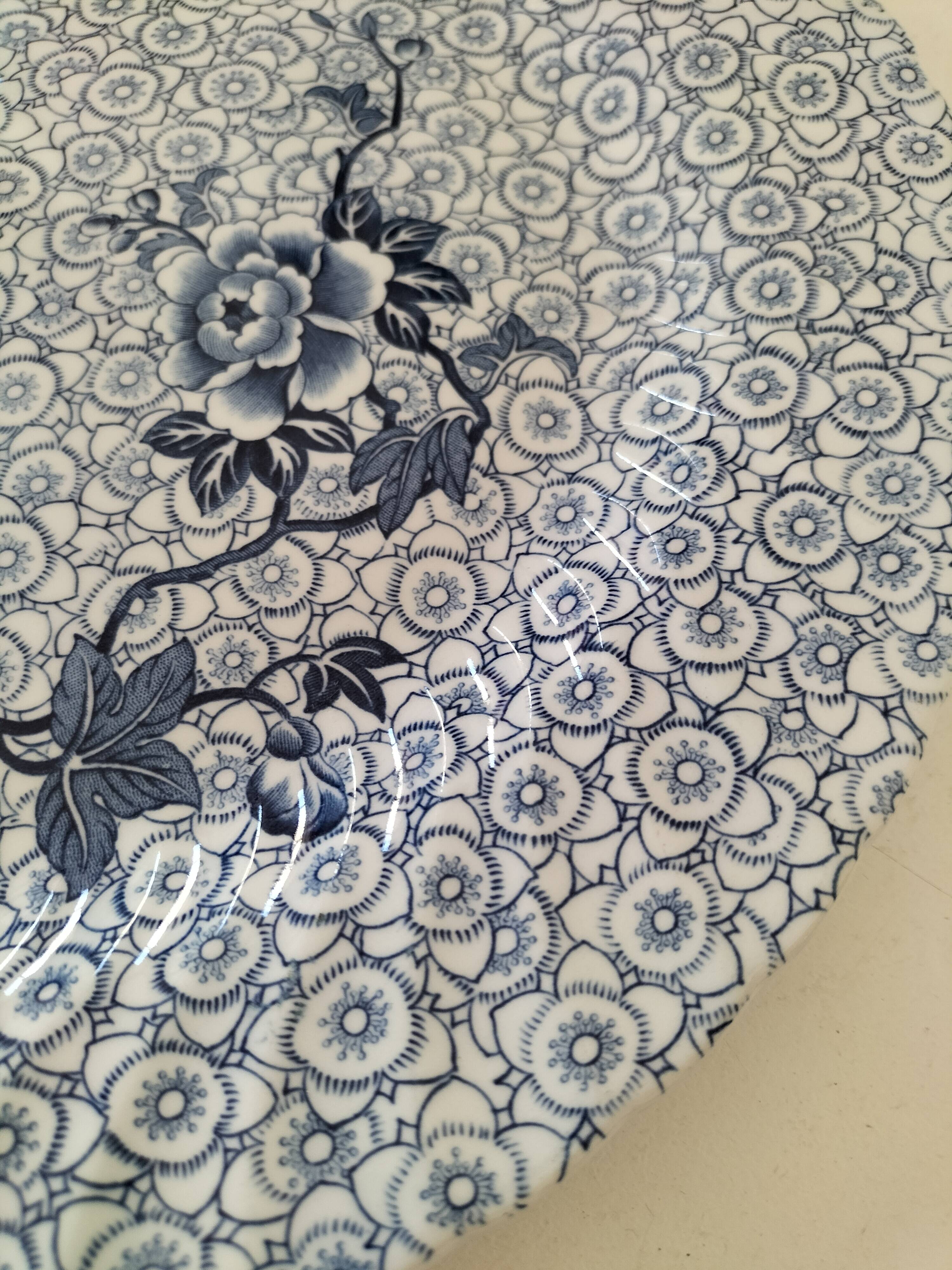 Round antique plate by Johnson Brothers in the Blue Lotus pattern.