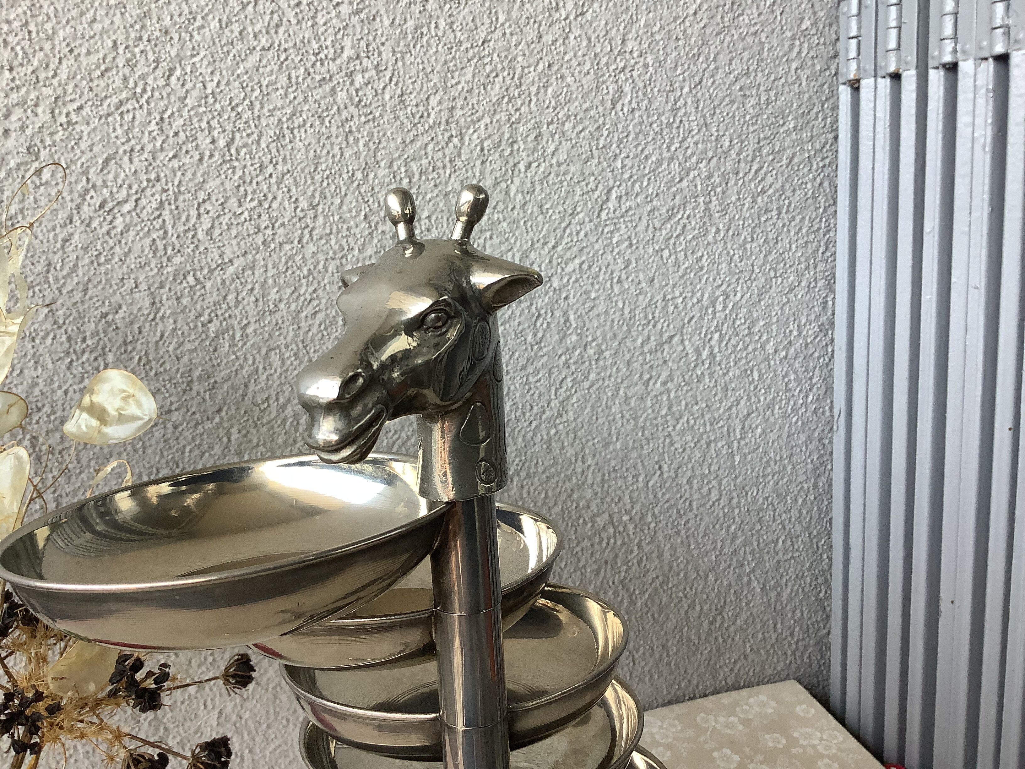 Bronze giraffe and silver metal servant