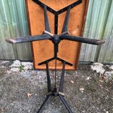 Vintage bistro table with an Art Deco style cast iron base and Formica top.